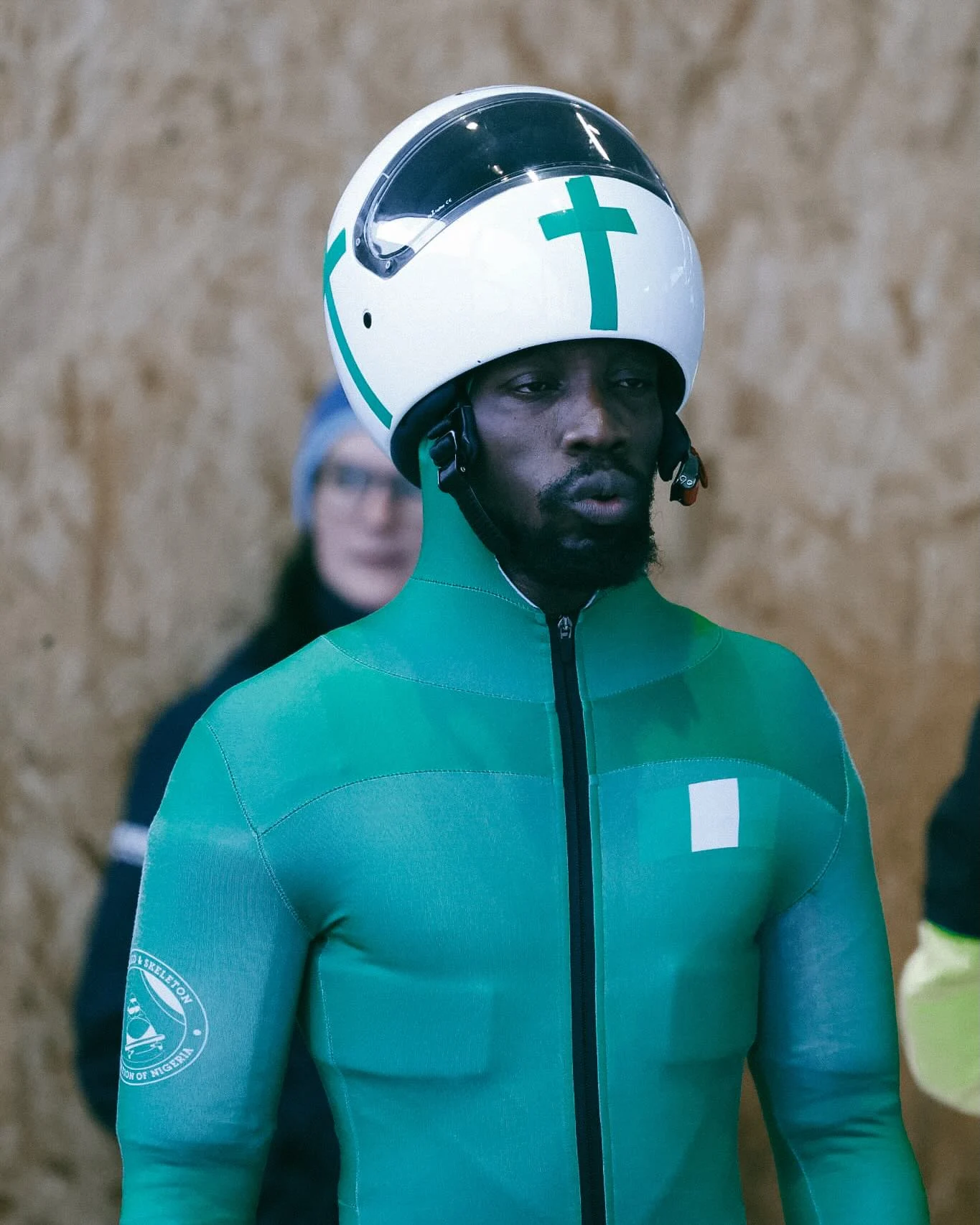 Yinka focused in his green Nigeria skeleton race suit and white helmet